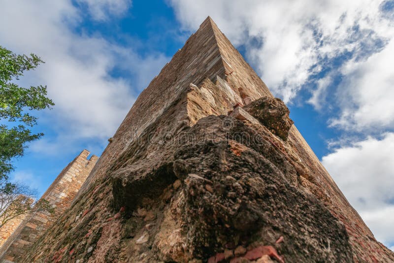 Corner of an ancient Saint George Castle wall with various types of masonry Castelo de SÃ£o Jorge.