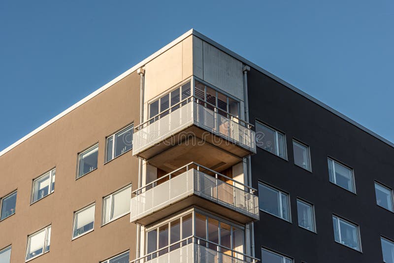 A Corner Apartment Building with Circular Round Balcony, Railings and