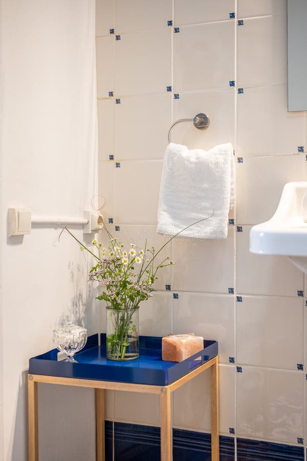 Corner of a Bathroom with a Decorative Low Decorative Table with a Blue