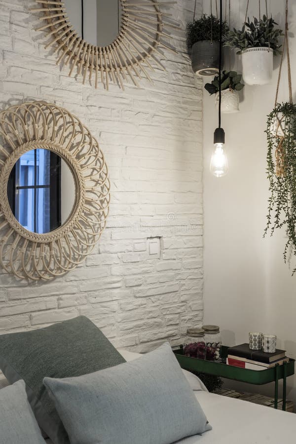 Corner of a Bedroom with a White Brick Wall, Hanging Plants and