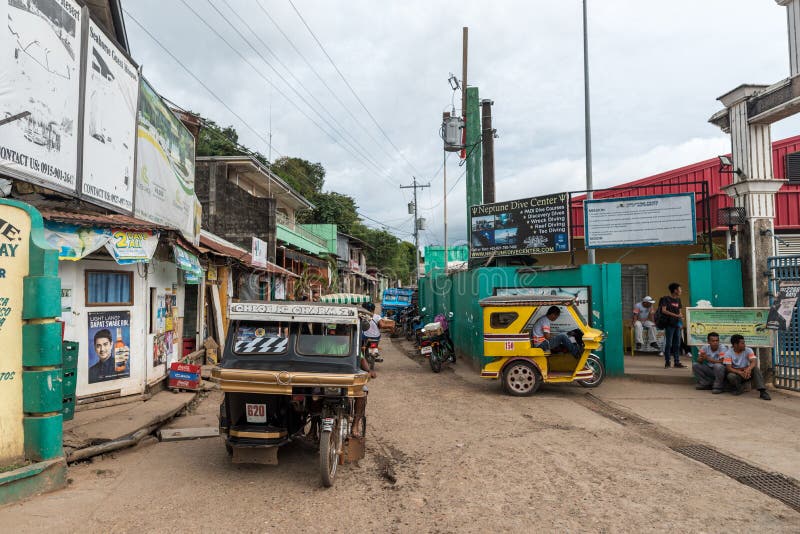 CORON, PHILIPPINES - JANUARY 28, 2018: Coron street with tricycle in Philippines royalty free stock images CORON, PHILIPPINES - JANUARY 28, 2018: Coron street with tricycle in Philippines royalty free stock images