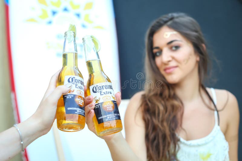 ZAGREB, CROATIA - JUNE 28, 2017 : Hostesses posing with Corona bottles on t...
