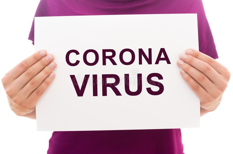 Girl holding white paper sheet with text Corona Virus