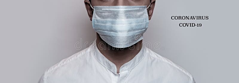 Corona virus pandemic. Concept of Corona virus quarantine, Covid-19. The male face is covered with a medical mask