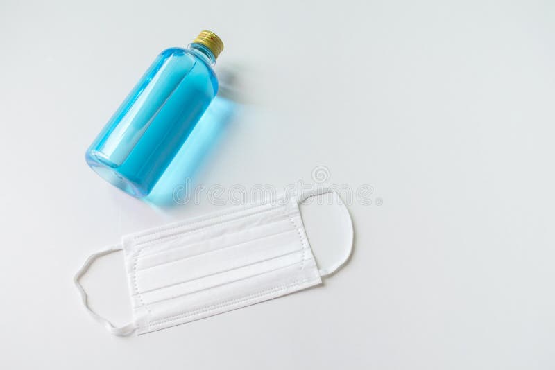 Coronavirus corona virus prevention travel surgical masks and hand sanitizer gel for hand hygiene spread protection. white backgro royalty free stock images Coronavirus corona virus prevention travel surgical masks and hand sanitizer gel for hand hygiene spread protection. white backgro royalty free stock images