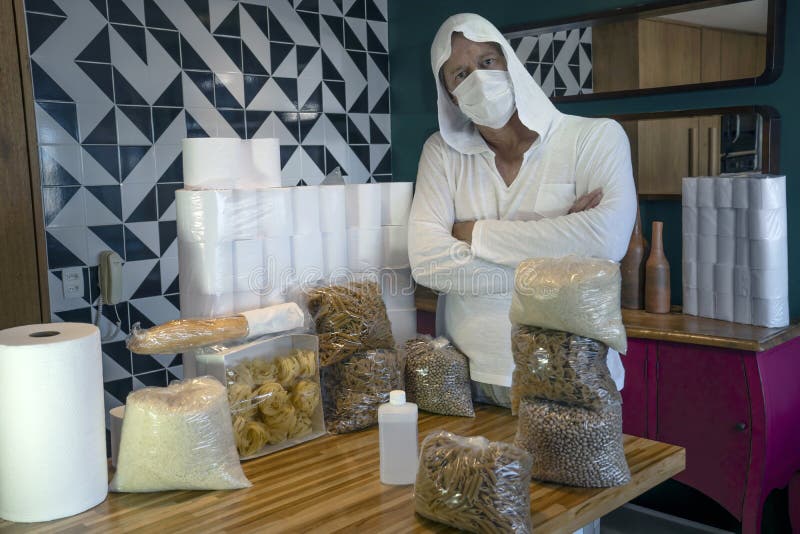 Coronavirus. Man storing food at home. Quarantined at home with a supply of food for months. royalty free stock images Coronavirus. Man storing food at home. Quarantined at home with a supply of food for months. royalty free stock images