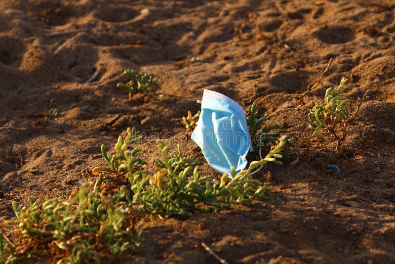 After the coronavirus, there are many abandoned protective equipment on the streets and beaches in Israel. After the coronavirus on the streets and beaches in stock photography After the coronavirus, there are many abandoned protective equipment on the streets and beaches in Israel. After the coronavirus on the streets and beaches in stock photography