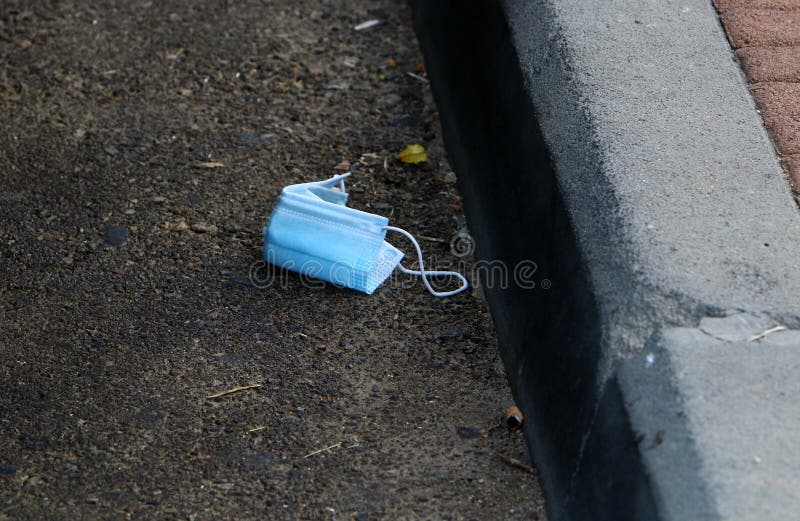 After the coronavirus, there are many abandoned protective equipment on the streets and beaches in Israel. After the coronavirus on the streets and beaches in stock photo After the coronavirus, there are many abandoned protective equipment on the streets and beaches in Israel. After the coronavirus on the streets and beaches in stock photo