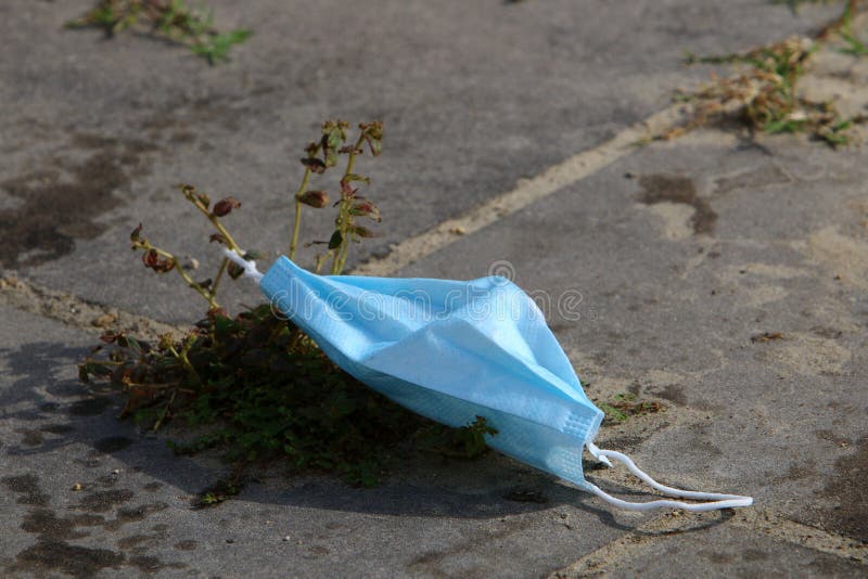 After the coronavirus, there are many abandoned protective equipment on the streets and beaches in Israel. After the coronavirus on the streets and beaches in royalty free stock photo After the coronavirus, there are many abandoned protective equipment on the streets and beaches in Israel. After the coronavirus on the streets and beaches in royalty free stock photo