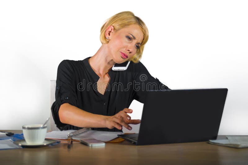 Corporate business portrait of young beautiful and busy woman with blonde hair working at office laptop computer desk talking on m