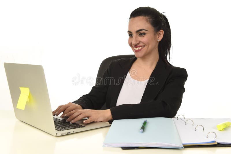 Corporate portrait of young beautiful hispanic woman working happy and relaxed at laptop office
