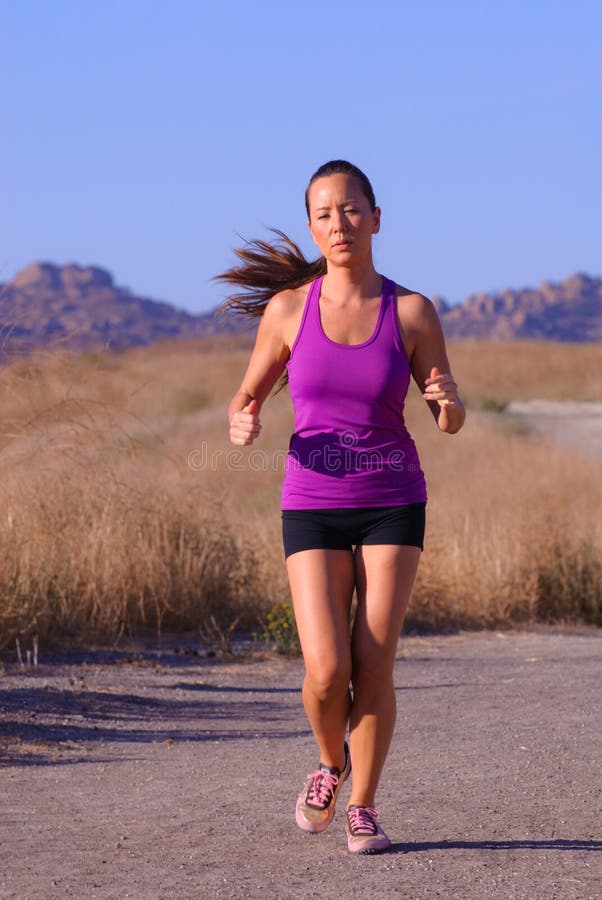 Beautiful asian female runner in purple top. Beautiful asian female runner in purple top