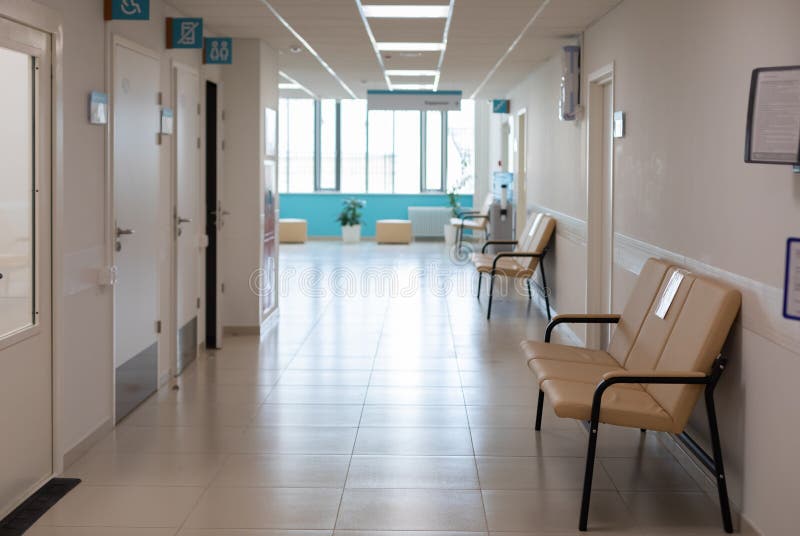 Empty corridor of hospitals, clinics, office rent. Sofas for seating and waiting area. Nobody. Empty corridor of hospitals, clinics, office rent. Sofas for seating and waiting area. Nobody