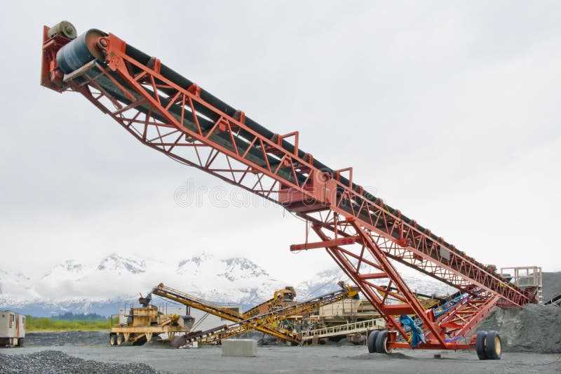 A large, mobile conveyor belt used to move sand and gravel at a sandpit, Valdez, Alaska. A large, mobile conveyor belt used to move sand and gravel at a sandpit, Valdez, Alaska.