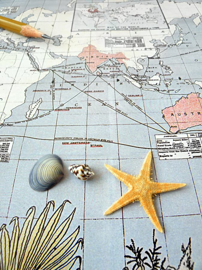 An old vintage map of the asia pacific region, taken with some sea shells, starfish, and a pencil. Travel and geography concept image. nobody in picture. An old vintage map of the asia pacific region, taken with some sea shells, starfish, and a pencil. Travel and geography concept image. nobody in picture.