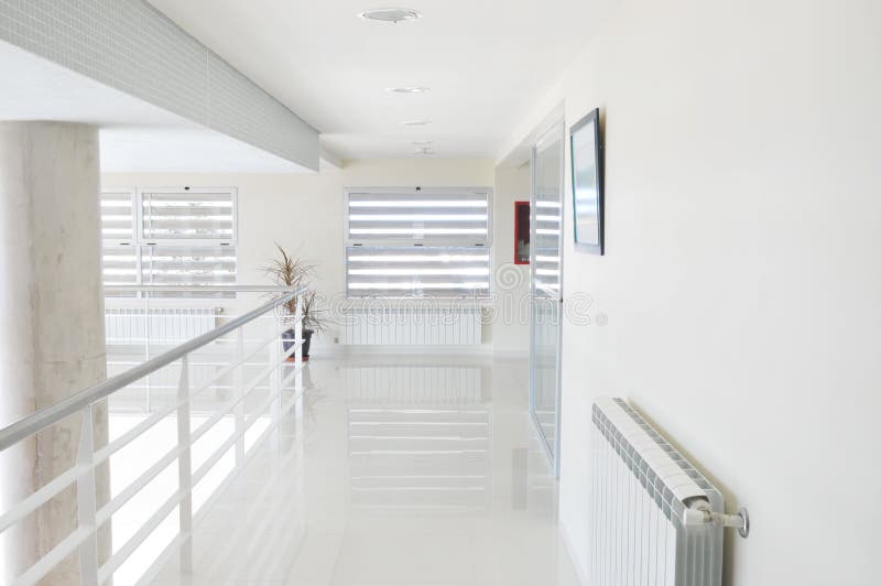 White corridor in the hospital. Modern building. White corridor in the hospital. Modern building.