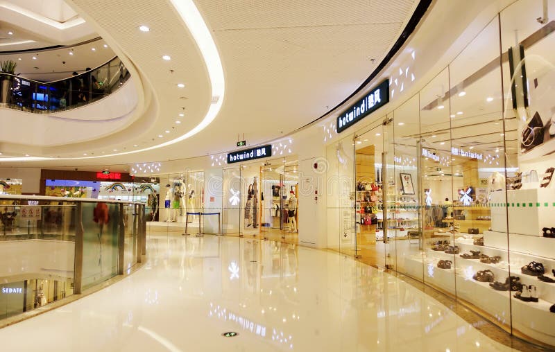 Modern shopping mall with fashion stores and shops. Interior of modern city shopping center. Fashion shop display window, boutique store sale window in shopping mall. Modern shopping mall with fashion stores and shops. Interior of modern city shopping center. Fashion shop display window, boutique store sale window in shopping mall.