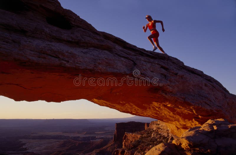 Corridore sull'arco fotografie stock Corridore sull'arco fotografie stock