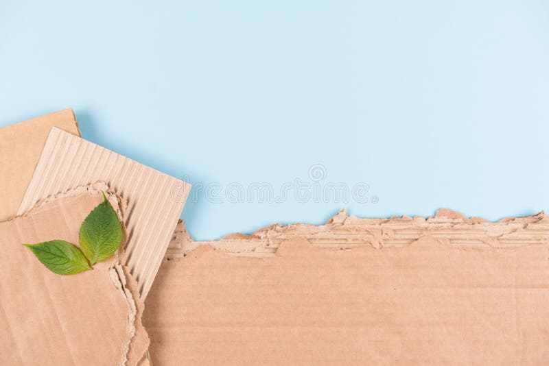 Corrugated Cardboard Sheets Over Light Blue Background As Eco
