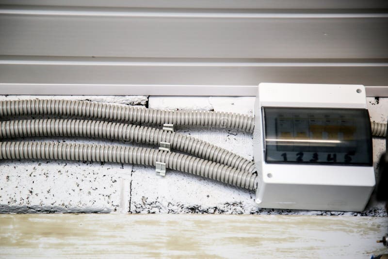 Corrugation for electrical wiring attached to the wall. Electrical installation system in new home construction