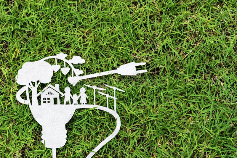 Corte del papel del eco en hierba verde Historias sobre ahorro de la energía imagen de archivo libre de regalías Corte del papel del eco en hierba verde Historias sobre ahorro de la energía imagen de archivo libre de regalías