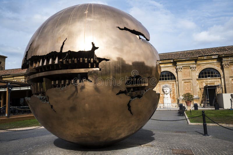Cortile della Pigna. Sphere within a sphere by Pomodoro 1990 in the Gardens of the Vatican Museums in Rome Italy stock image Cortile della Pigna. Sphere within a sphere by Pomodoro 1990 in the Gardens of the Vatican Museums in Rome Italy stock image