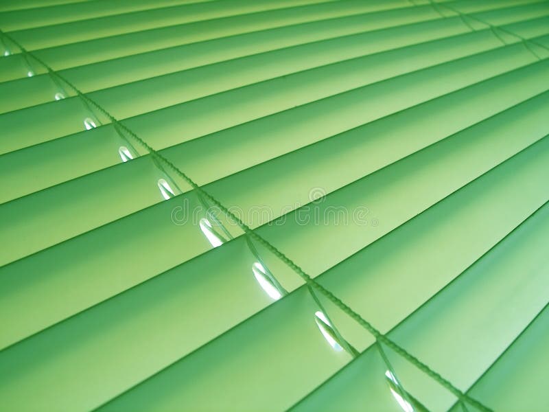 Pastel green plastic venetian blinds. Pastel green plastic venetian blinds.