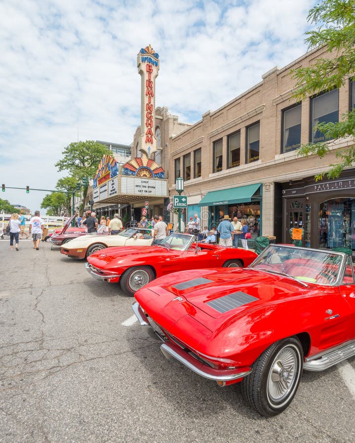 BIRMINGHAM, MI/USA - AUGUST 16, 2014: Four Corvette cars at the Birmingham Theatre (Palladium) at the Woodward Dream Cruise, the world's largest one-day automotive event. Woodward is a National Scenic Byway and Michigan Heritage Route. BIRMINGHAM, MI/USA - AUGUST 16, 2014: Four Corvette cars at the Birmingham Theatre (Palladium) at the Woodward Dream Cruise, the world's largest one-day automotive event. Woodward is a National Scenic Byway and Michigan Heritage Route.