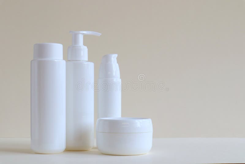 Cosmetic products for face and body in containers without labels. The concept of Spa skin care and body