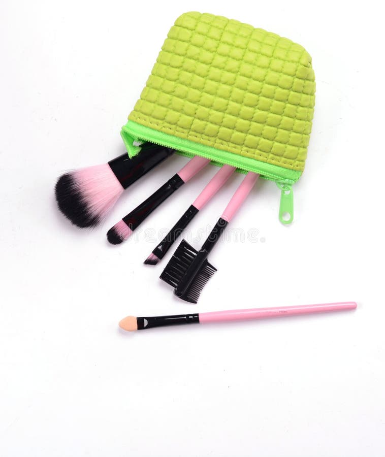 Cosmetics in green bag stock image. Image of facepowder 79418741