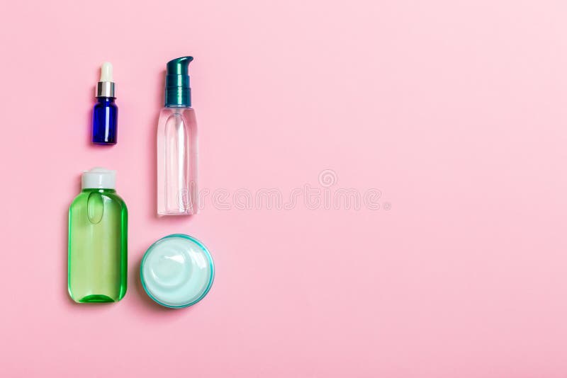 Cosmetics SPA branding mock-up, top view with copy space. set of tubes and jars of cream flat lay on pink background stock image Cosmetics SPA branding mock-up, top view with copy space. set of tubes and jars of cream flat lay on pink background stock image