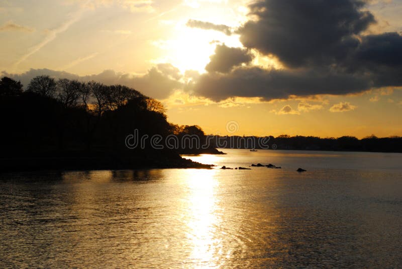 A cloudy New England coastal landscape before sunset. A cloudy New England coastal landscape before sunset.