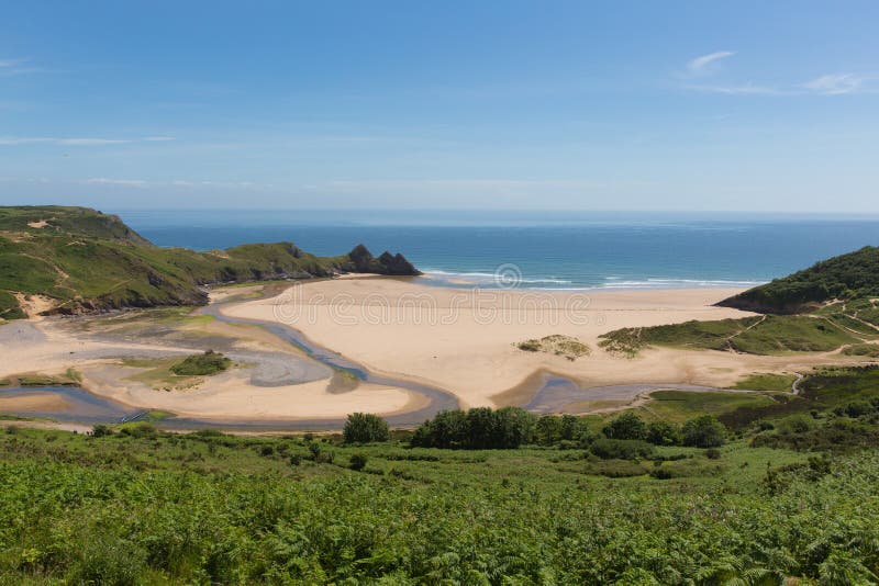 Costa sud della baia di tre scogliere Gower Peninsula Swansea Wales Regno Unito immagine stock Costa sud della baia di tre scogliere Gower Peninsula Swansea Wales Regno Unito immagine stock