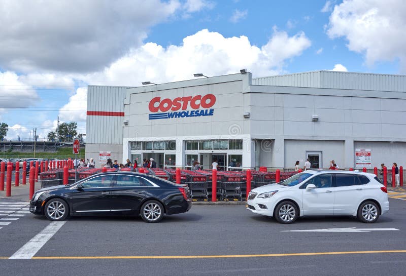 MONTREAL, CANADA - AUGUST 25, 2016 : Costco Wholesale store and logo. Costco Wholesale Corporation trading as Costco, is the largest American membership-only warehouse club. MONTREAL, CANADA - AUGUST 25, 2016 : Costco Wholesale store and logo. Costco Wholesale Corporation trading as Costco, is the largest American membership-only warehouse club