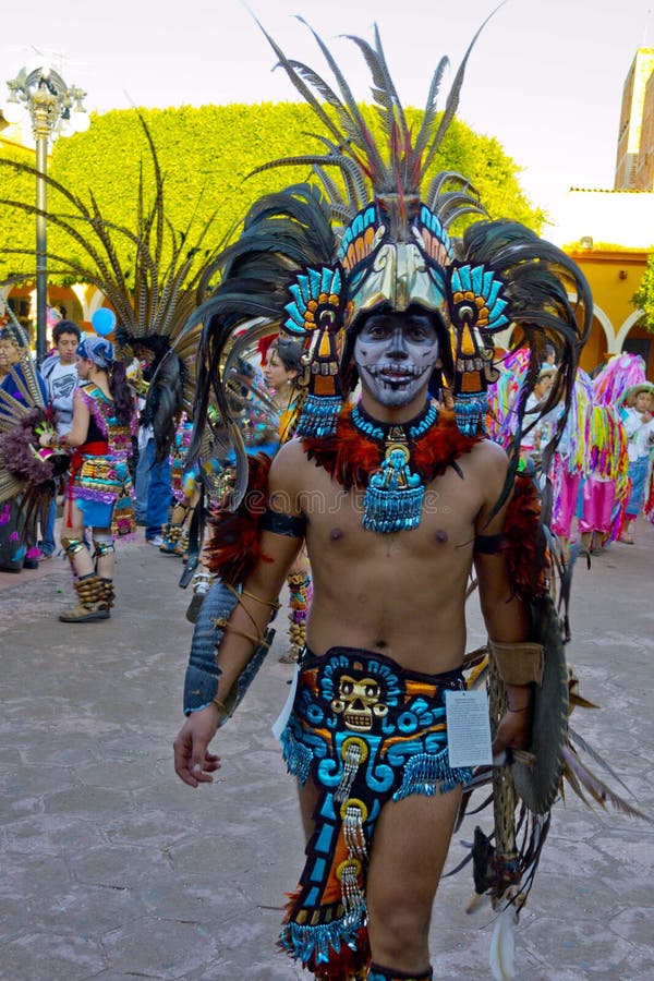 Costume Aztec warriors with shield and ax stock photos.