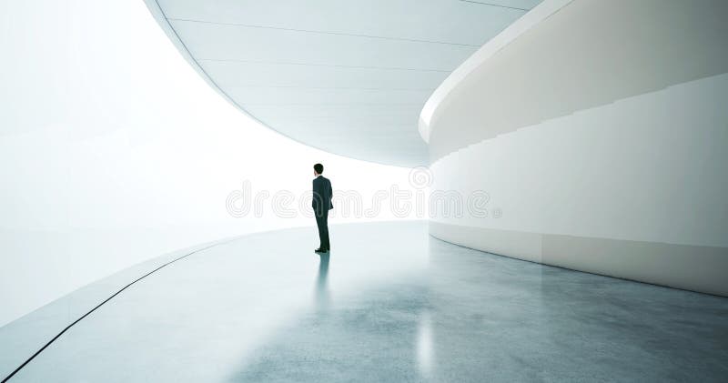 Costume de port et supports de jeune homme d'affaires dans image stock Costume de port et supports de jeune homme d'affaires dans image stock