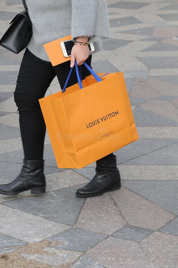 COSTUMER with LLOUIS VUITTON SHOPPING BAG Editorial Stock Photo - Image ...