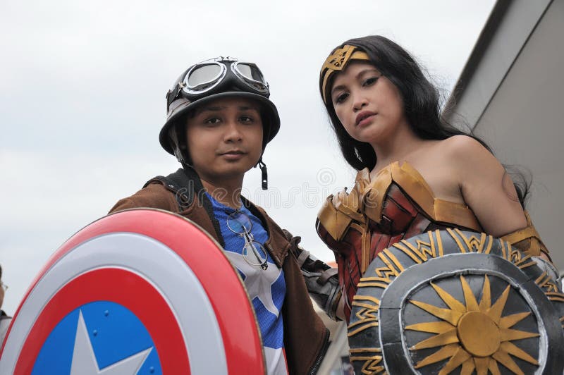 Costumers roleplaying Captain America and Wonder woman