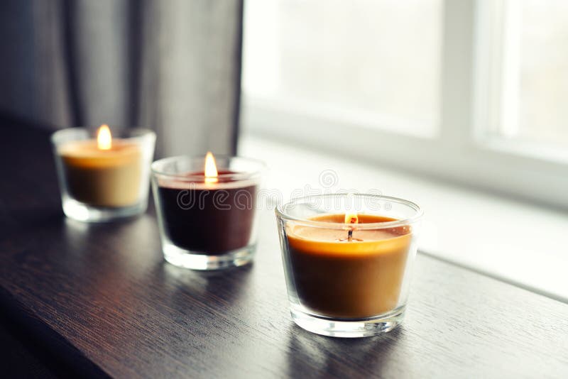 Cosy candles on an wooden table