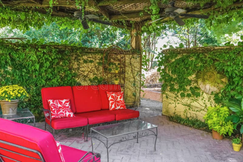 Cosy Outdoor Living Space Red Outdoor Furniture On Patio Under A