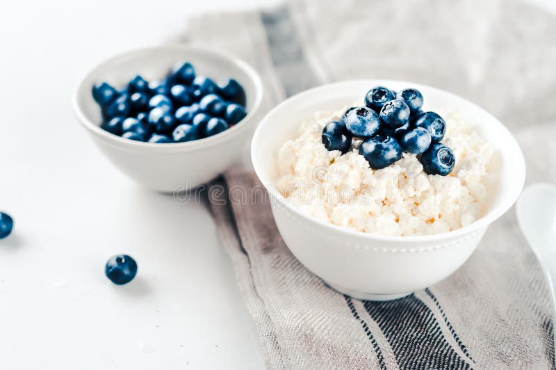 Cottage Cheese with Blueberries in a Bowl on a Table Stock Photo
