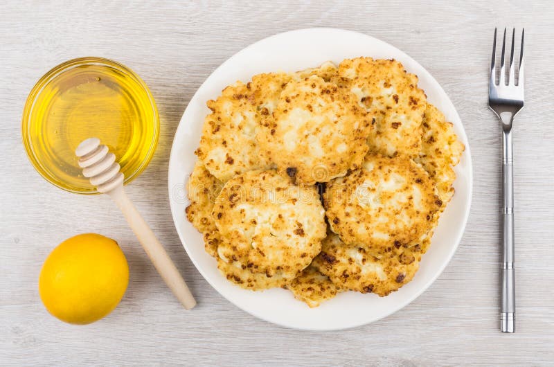 Cottage Cheese Pancakes, Honey and Lemon on Table Stock Photo Image