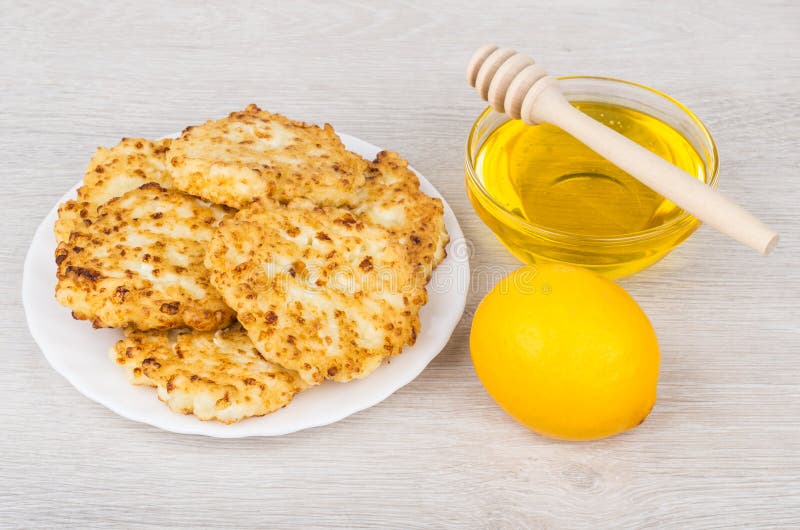 Cottage Cheese Pancakes in Plate, Bowl with Honey and Lemon Stock Photo Image of fried, curd