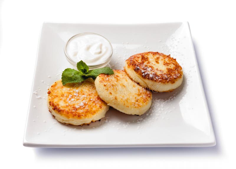 Cottage Cheese Pancakes with Sour Cream Stock Photo Image of plate