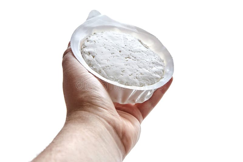 Cottage Cheese In Plastic Packaging Lying On The Hand Stock Photo