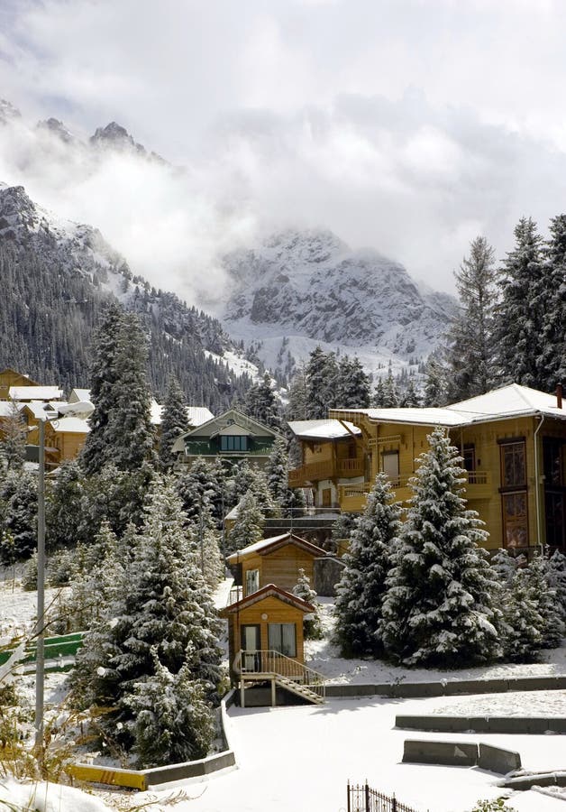 Cottages in winter mountains