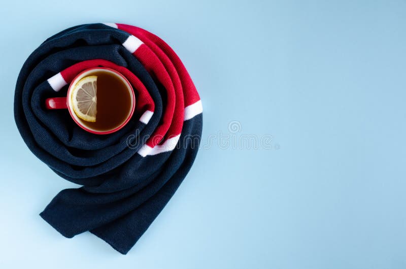 Cotton Colored Scarf with Tea Cup and Lemon Slice Composition on Blue Background Stock Image