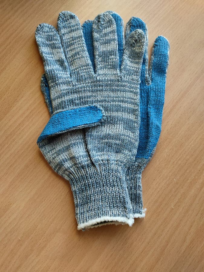 Cotton Gloves with Polyester Coating To Protect Hands Stock Photo