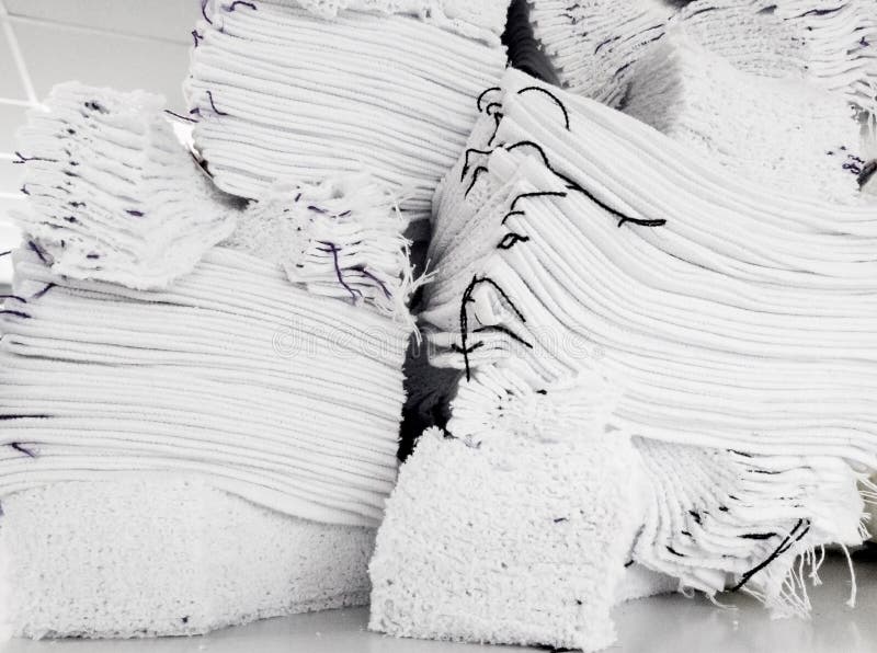 cotton white knitted parts are stacked for further processing