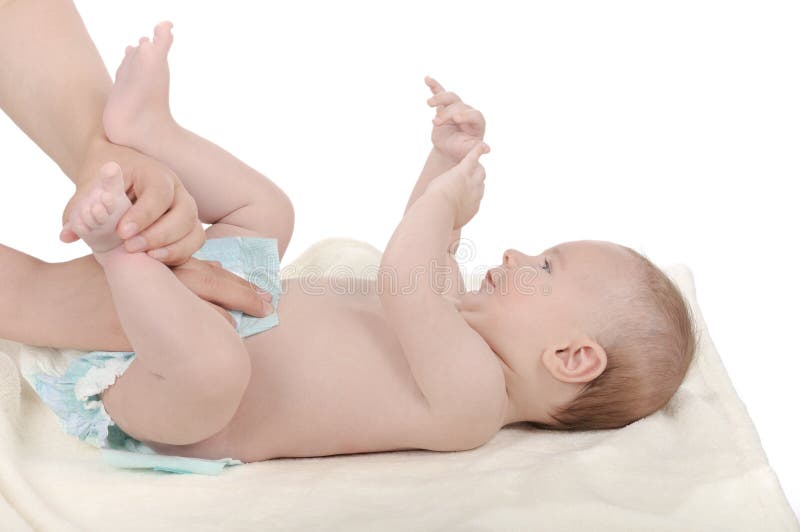 Mother changing baby a fresh diaper. Mother changing baby a fresh diaper